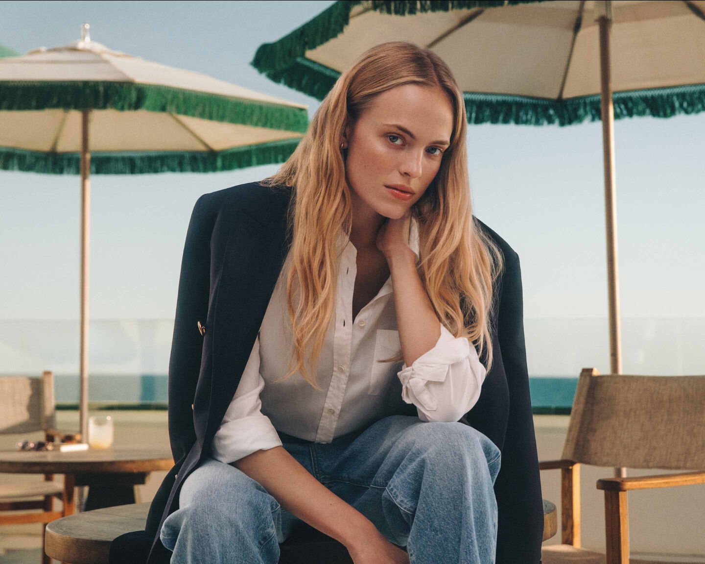 A women wearing Gant Preppy Rose Fragrance sitting on a table