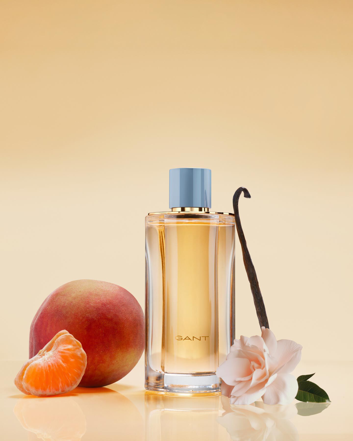 A yellow bottle of Gant women's fragrance with its notes